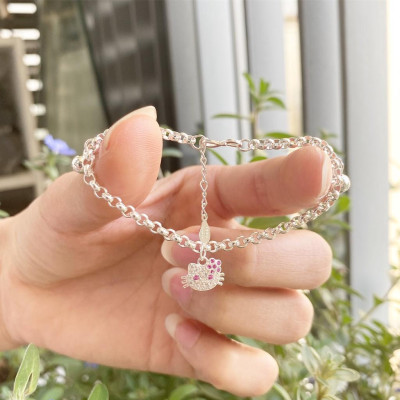 Lắc tay trẻ em dây mo treo 2 bi và kitty dâu tây đáng yêu Dế Bạc - LE4557