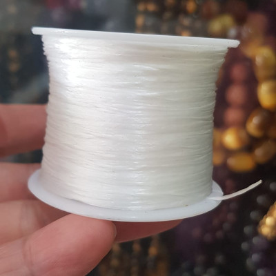 Cuộn Dây Thun CO GIÃN màu Trắng xỏ vòng hạt chuỗi Dây này là dây thun chuyên xỏ vòng chuỗi màu Trắng, có đủ màu Anh Chị đang đeo chuỗi muốn thay dây khác cho vòng thì đặt cuộn Thun chỉ này nhé 