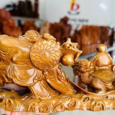 Tượng phật di lặc kéo bao rùa hóa rồng bằng gỗ bách xanh thơm nức kt ngang 20cm 