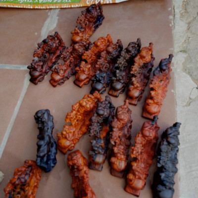 Tượng phật di lặc kéo bao tiền bằng gỗ trắc đỏ đen kt 16×6×7cm