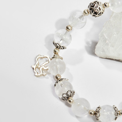 Vòng tay phong thủy nữ đá thạch anh ưu linh trắng charm cỏ 4 lá 8mm mệnh thủy , kim - Ngọc Quý Gemstones