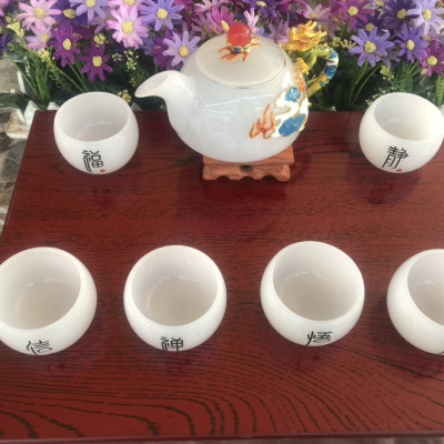 Bộ ấm trà chạm rồng đá bạch ngọc