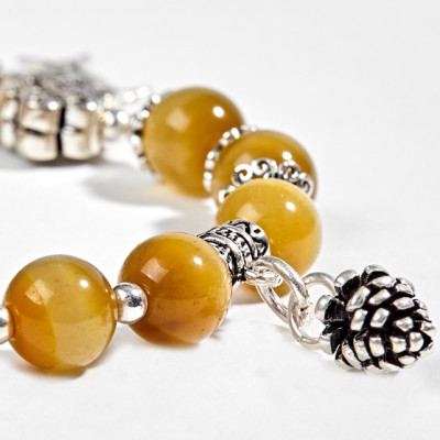 Vòng Thạch Anh Mắt Hổ Vàng Tâm Phối Charm Kết Đồng Tâm Bạc Ngọc Quý Gemstones